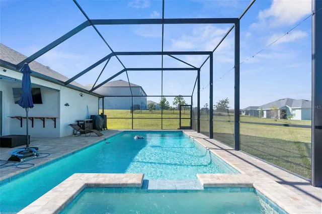 a view of a backyard of the house