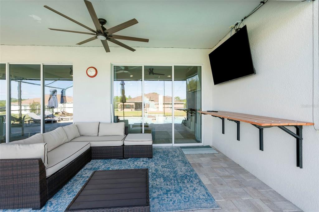 9347 North Star Court Weeki Wachee, FL 34613 - Photo 35 of 46 a living room with furniture tv and a window
