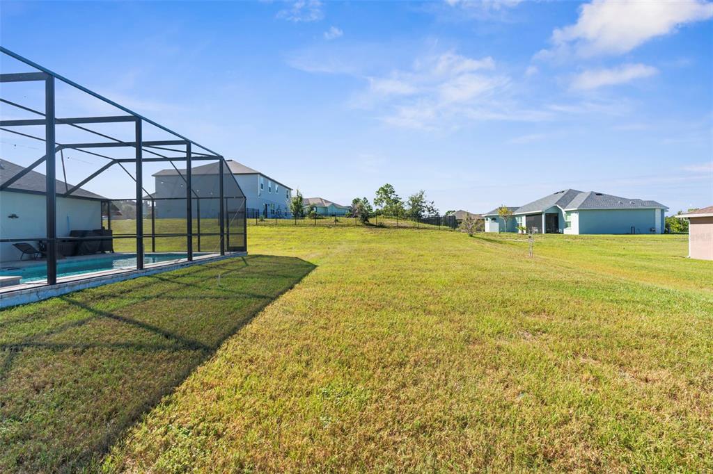 9347 North Star Court Weeki Wachee, FL 34613 - Photo 39 of 46 a view of a yard with an outdoor seating