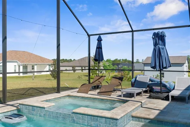 a view of swimming pool with patio