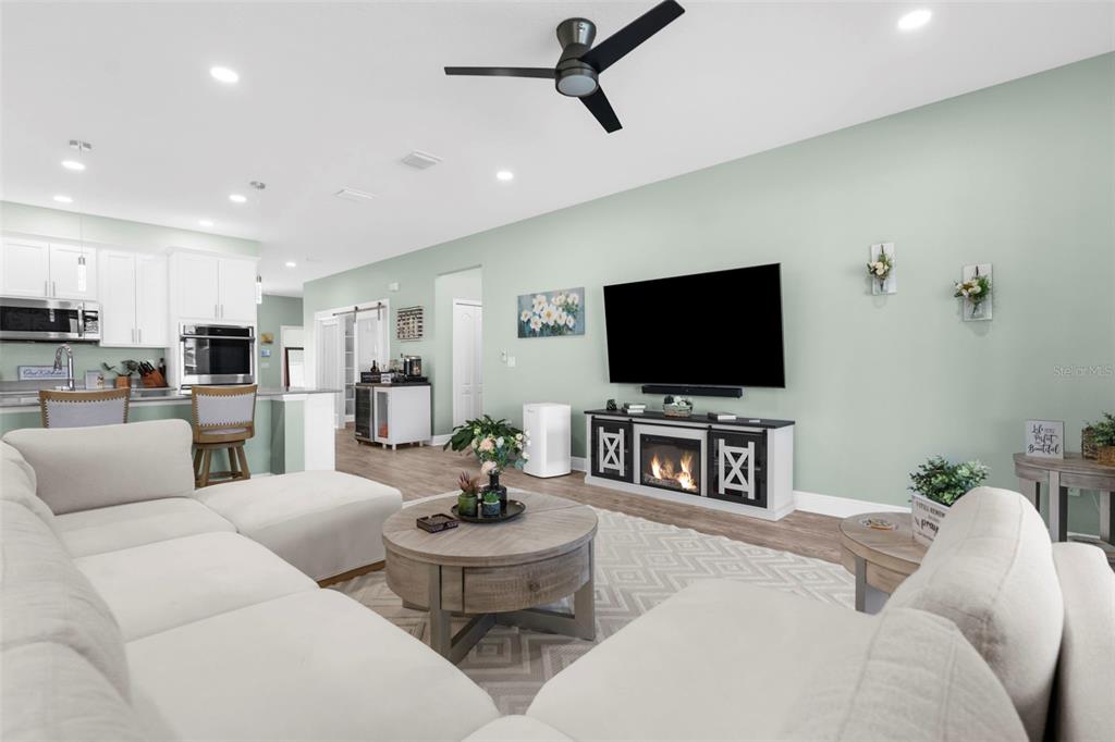 9347 North Star Court Weeki Wachee, FL 34613 - Photo 7 of 46 a living room with furniture and a flat screen tv