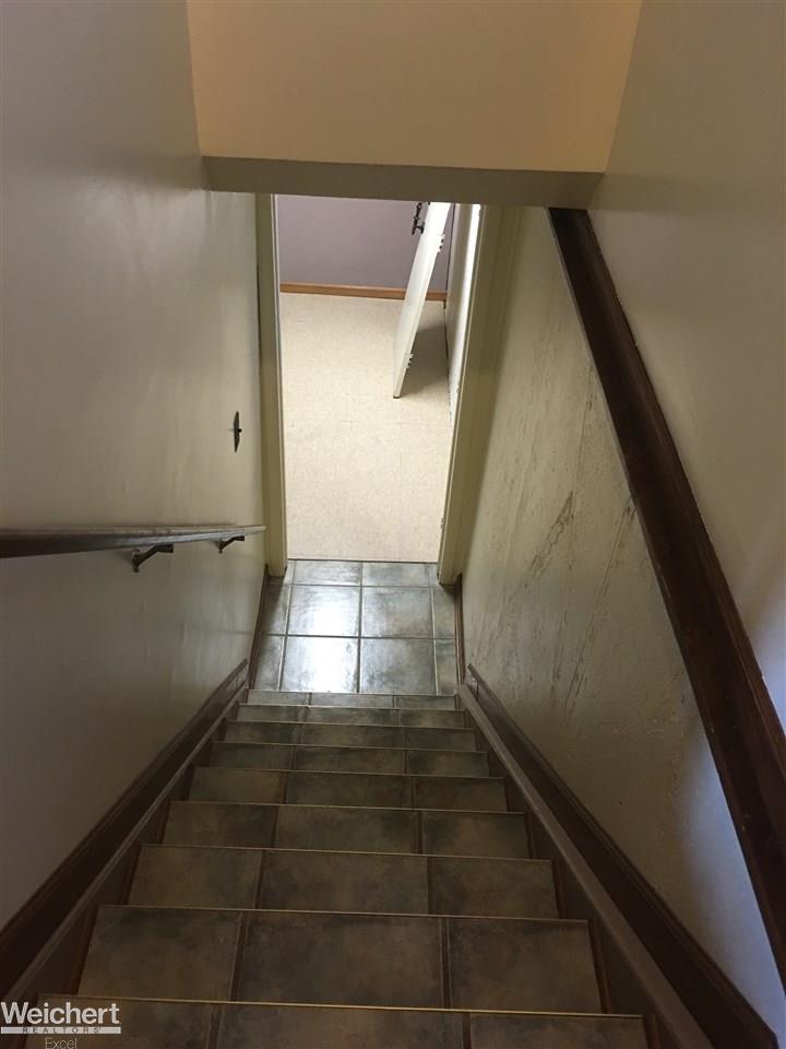 30505 Hayes Road Warren, MI 48088 - Photo 26 of 33 Tile staircase leading to finished basement