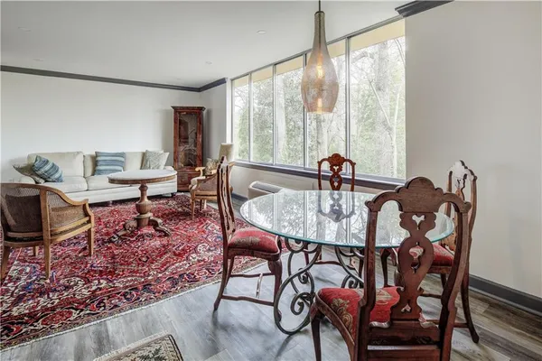a view of a dining room with furniture window and outside view