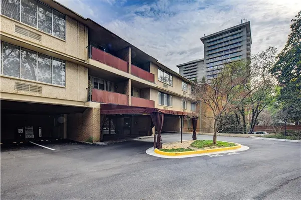 a view of pool with brick walls