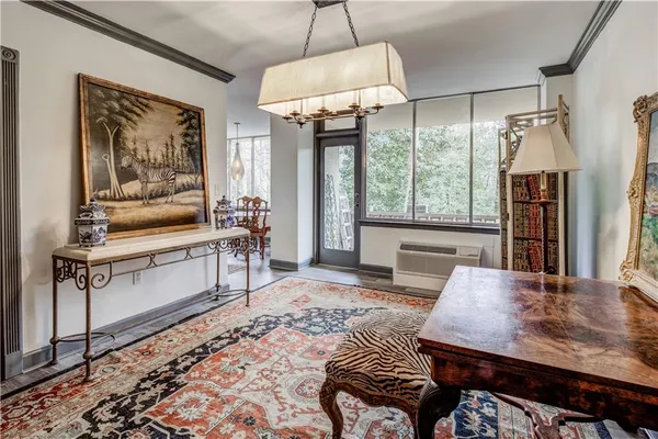 a view of a dining room with furniture window and wooden floor