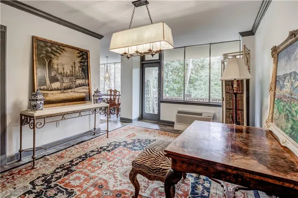 a view of a livingroom with furniture window and wooden floor