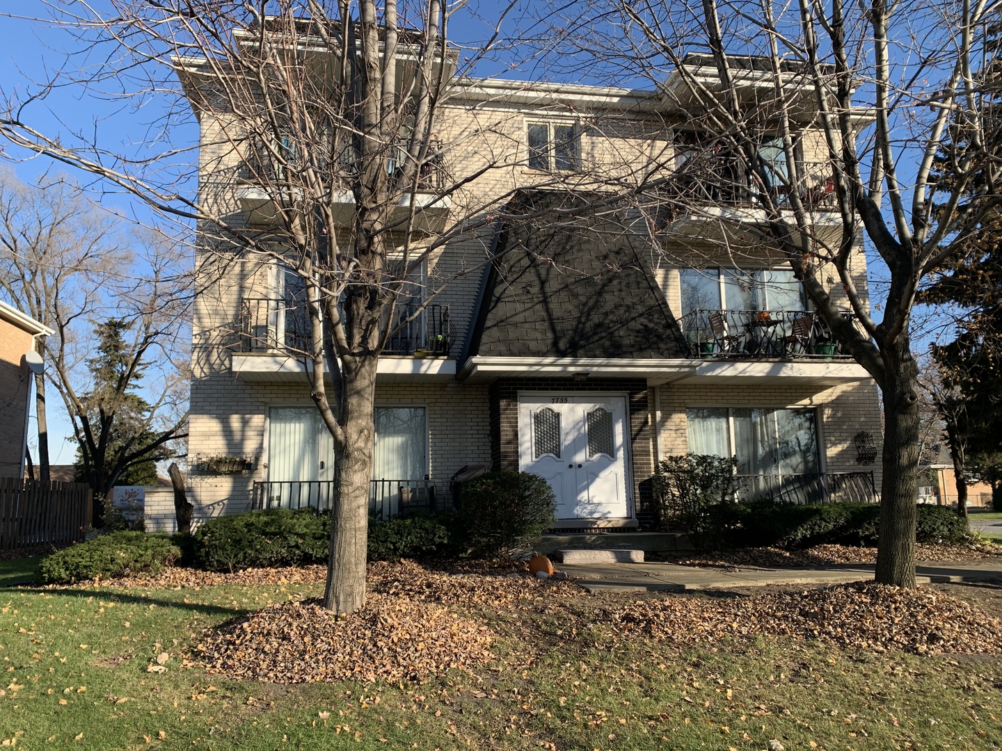 7755 South Roberts Road, Unit 2 Bridgeview, IL 60455 - Photo 1 of 13 a view of a house with a yard
