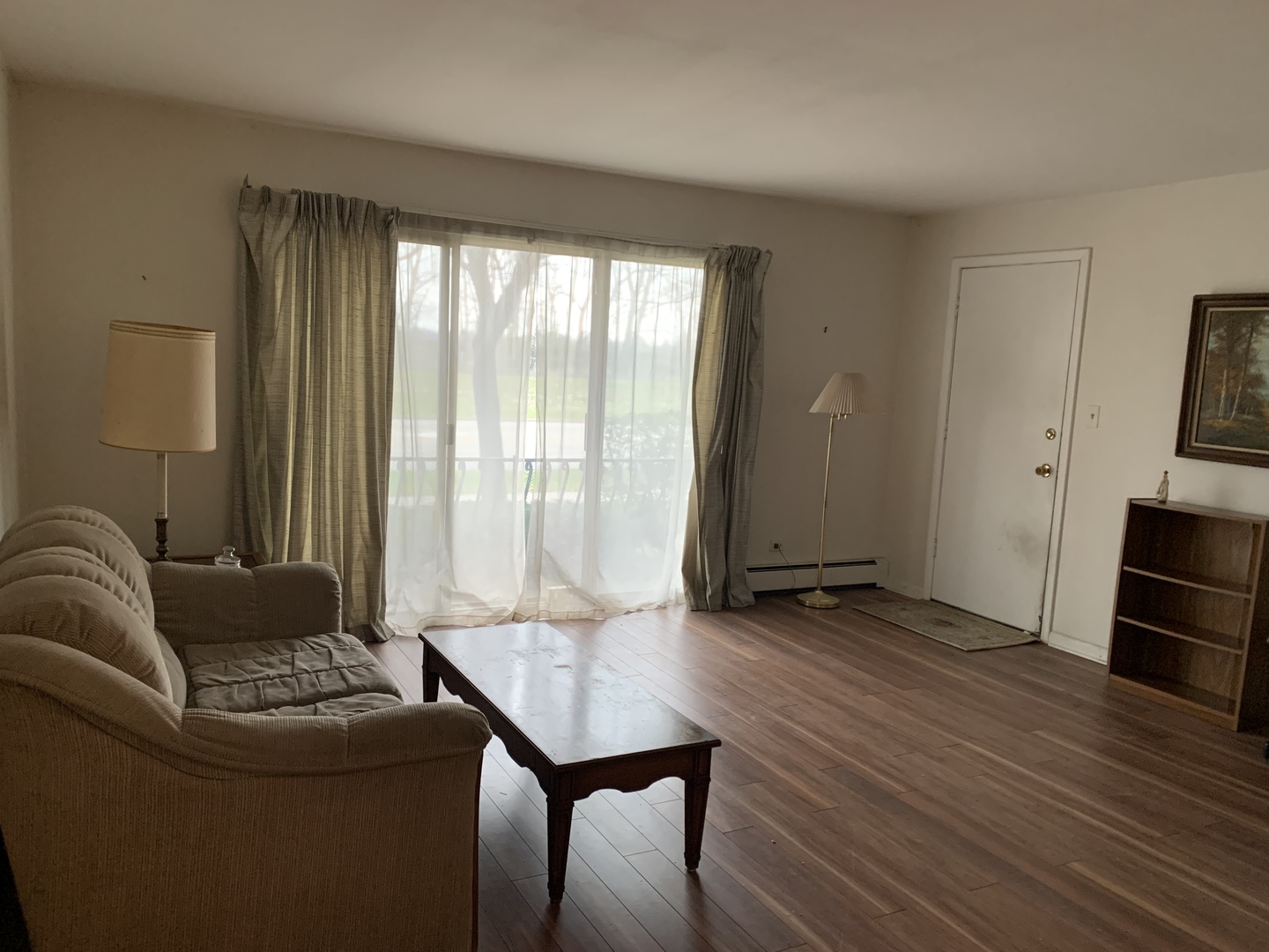 7755 South Roberts Road, Unit 2 Bridgeview, IL 60455 - Photo 2 of 13 a living room with furniture and a large window