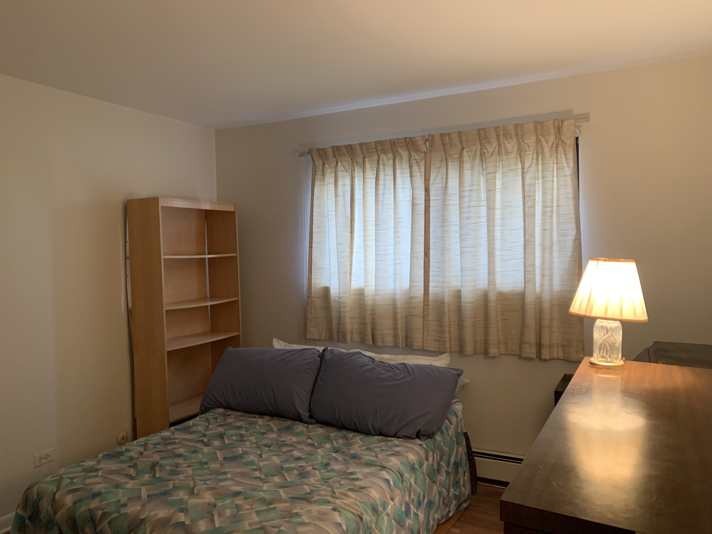 7755 South Roberts Road, Unit 2 Bridgeview, IL 60455 - Photo 11 of 13 a bedroom with a bed and a lamp