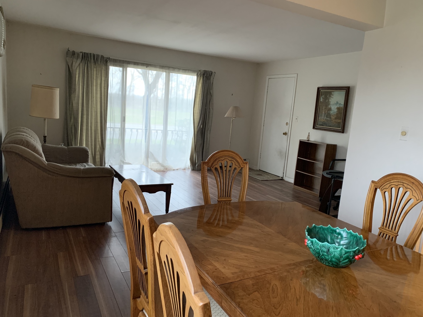 7755 South Roberts Road, Unit 2 Bridgeview, IL 60455 - Photo 3 of 13 a view of a dining room with furniture window and wooden floor