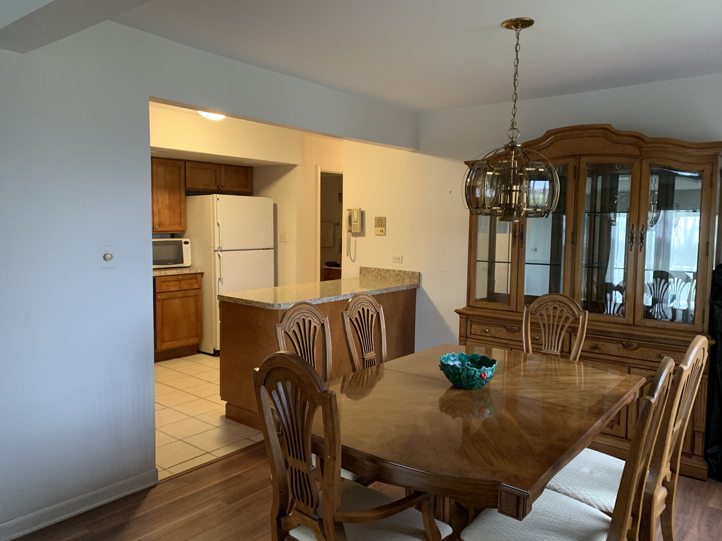 7755 South Roberts Road, Unit 2 Bridgeview, IL 60455 - Photo 4 of 13 a dining room with furniture a chandelier and window