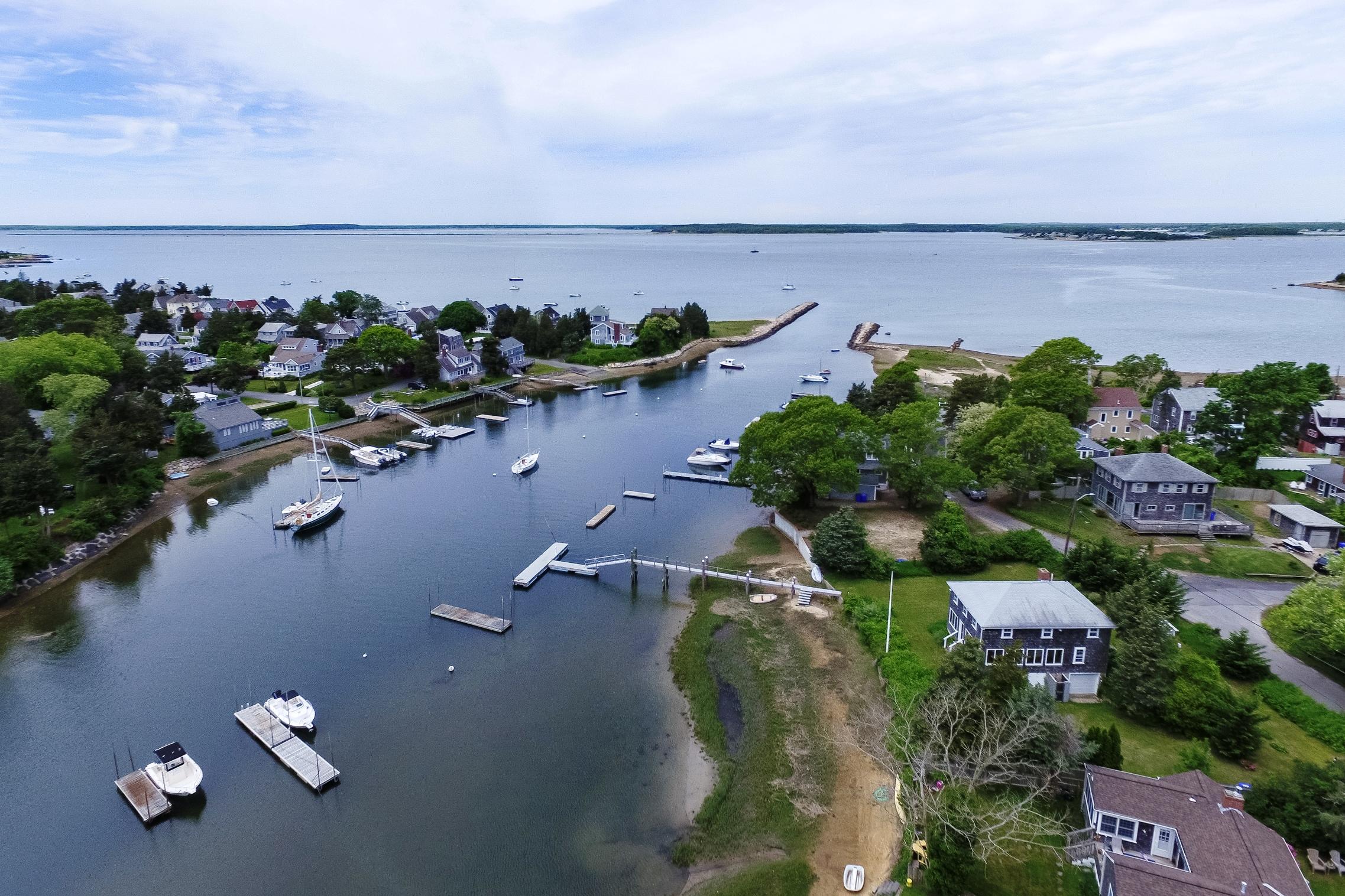 87 Tahanto Road Pocasset, MA 02559 - Photo 2 of 29 an aerial view of a house with a yard