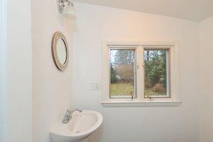 87 Tahanto Road Pocasset, MA 02559 - Photo 22 of 29 a bathroom with a sink and a mirror