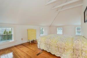 87 Tahanto Road Pocasset, MA 02559 - Photo 23 of 29 a bedroom with a bed and a window