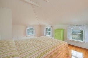87 Tahanto Road Pocasset, MA 02559 - Photo 24 of 29 a bedroom with a bed and a window