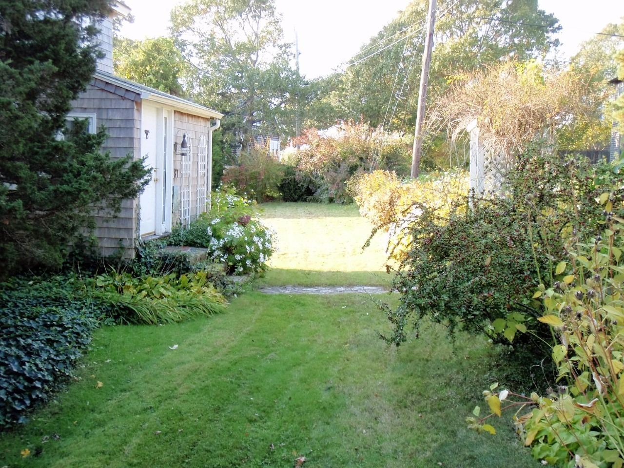 87 Tahanto Road Pocasset, MA 02559 - Photo 9 of 29 a view of a yard in front of house