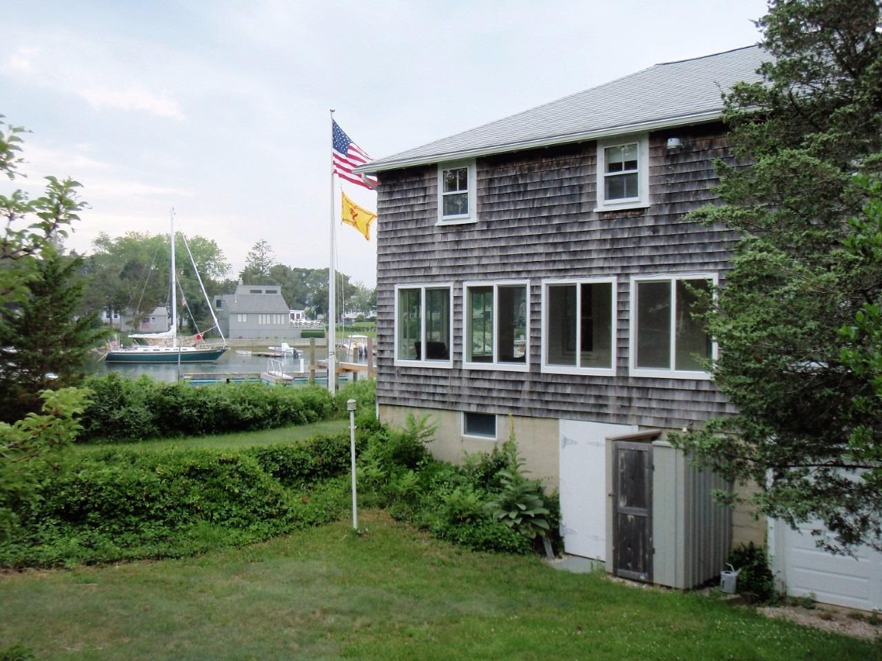 87 Tahanto Road Pocasset, MA 02559 - Photo 10 of 29 a house view with a garden space