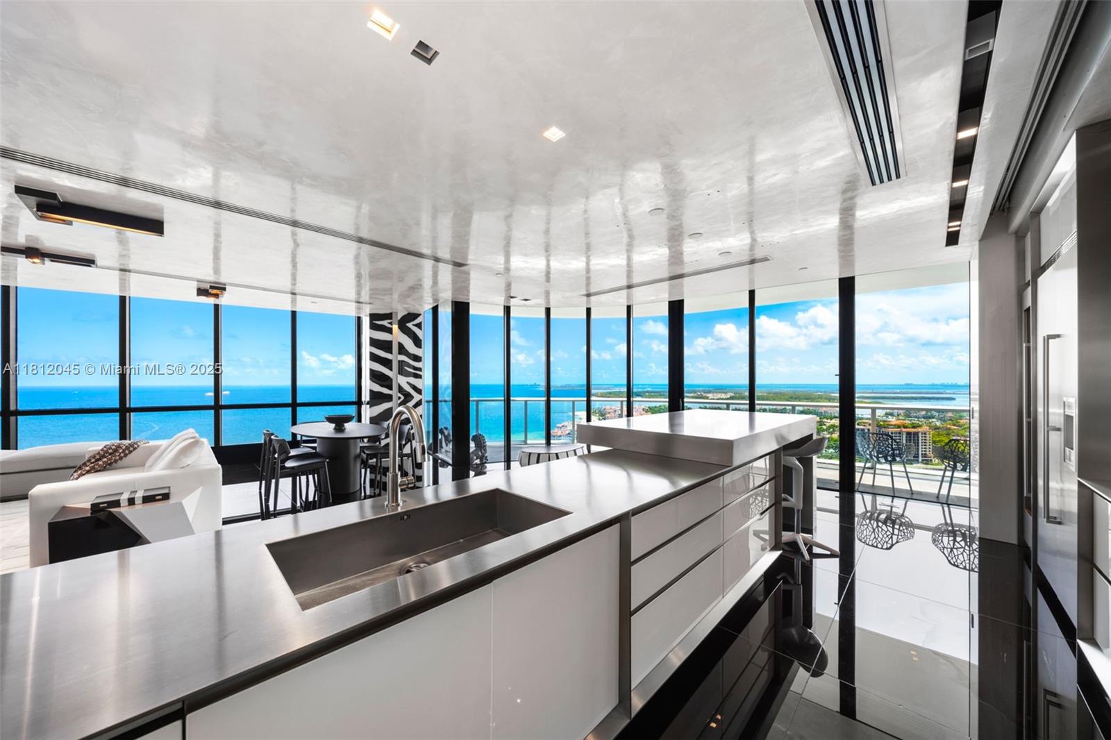 a kitchen with counter top a stove and cabinets
