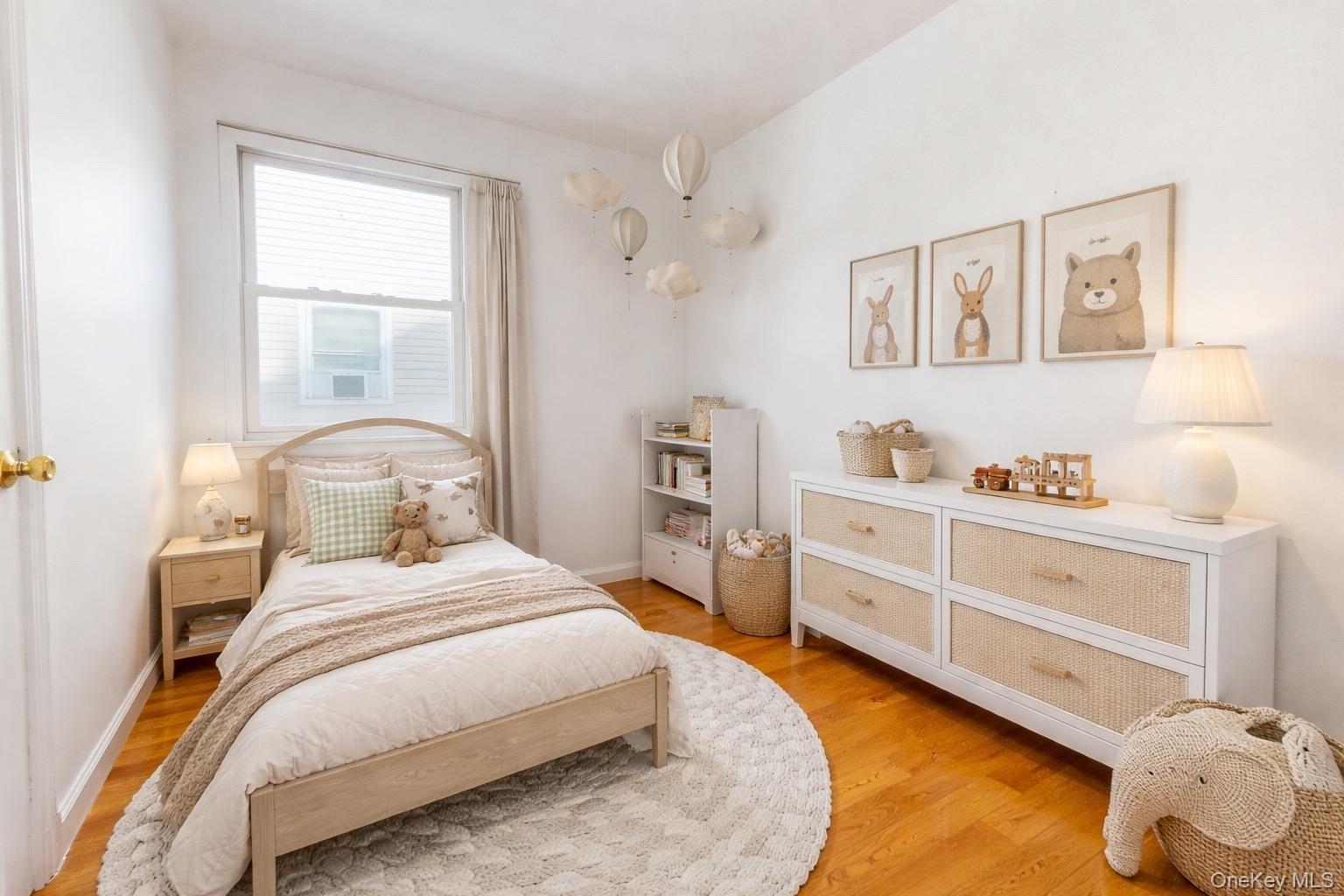 219-42 141st Road Queens, NY 11413 - Photo 7 of 23 a bedroom with a bed and a window