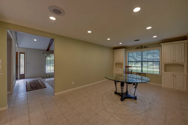 a view of a room with furniture and a window