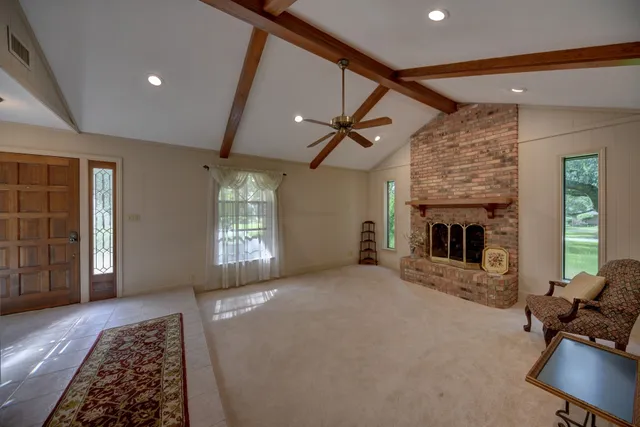 a view of livingroom with furniture and a fireplace