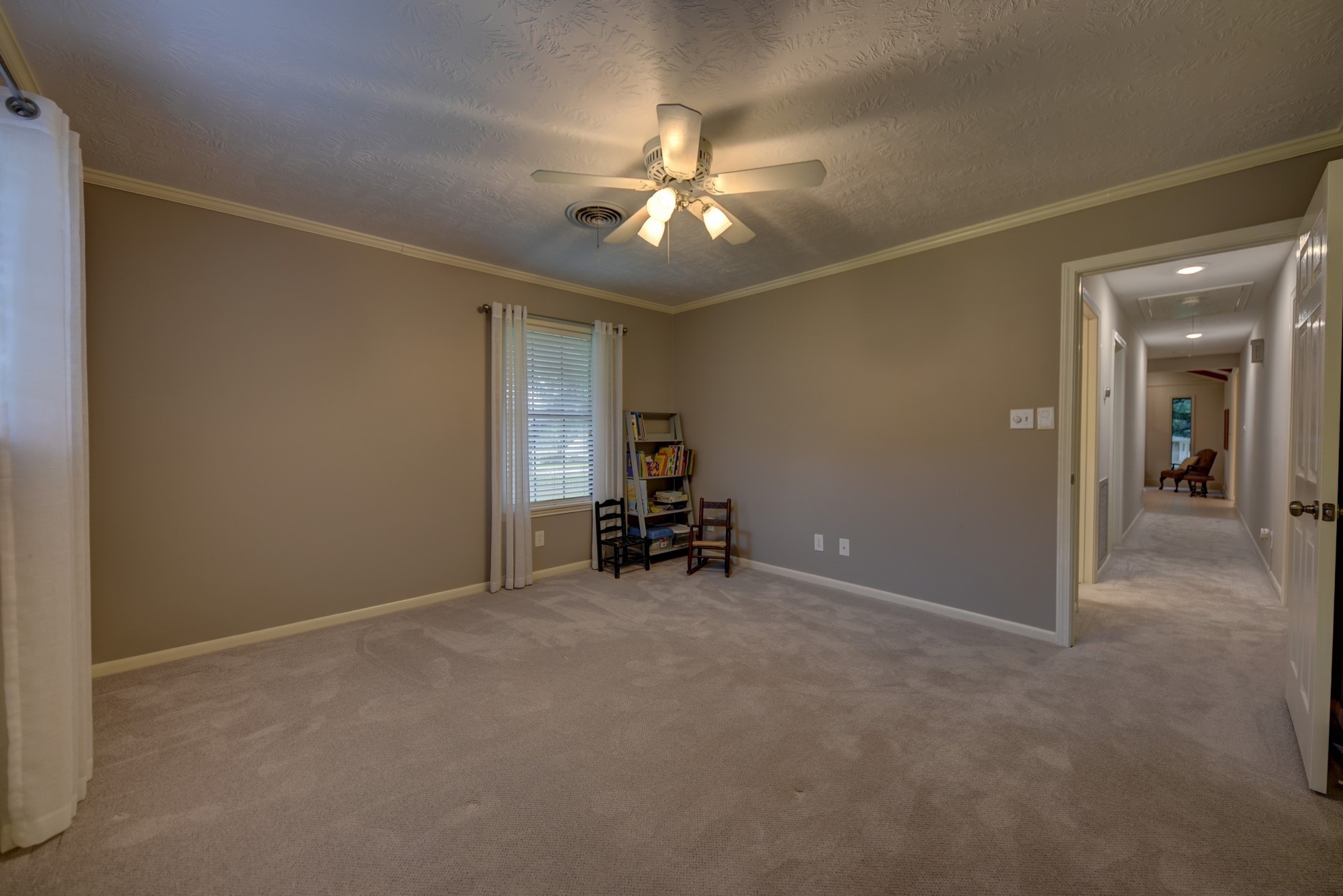 2502 Cheri Lane Brenham, TX 77833 - Photo 35 of 46 a view of a livingroom with a furniture and chandelier fan