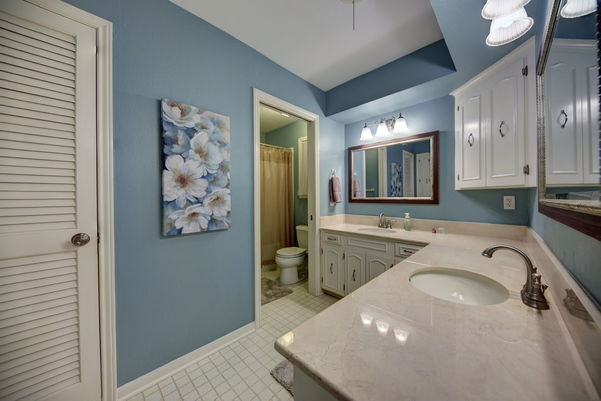 2502 Cheri Lane Brenham, TX 77833 - Photo 36 of 46 a bathroom with a sink a vanity and a mirror