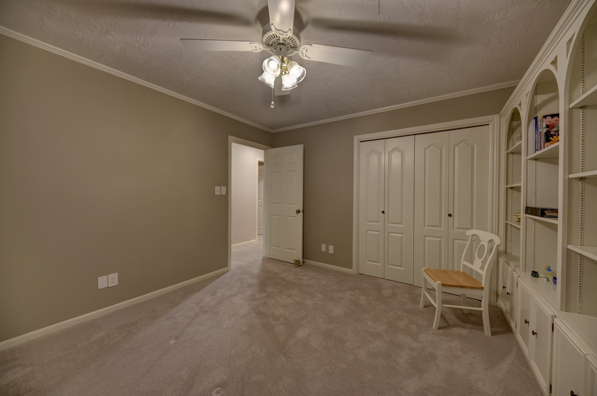 2502 Cheri Lane Brenham, TX 77833 - Photo 38 of 46 a view of a livingroom with a chair and chandelier fan