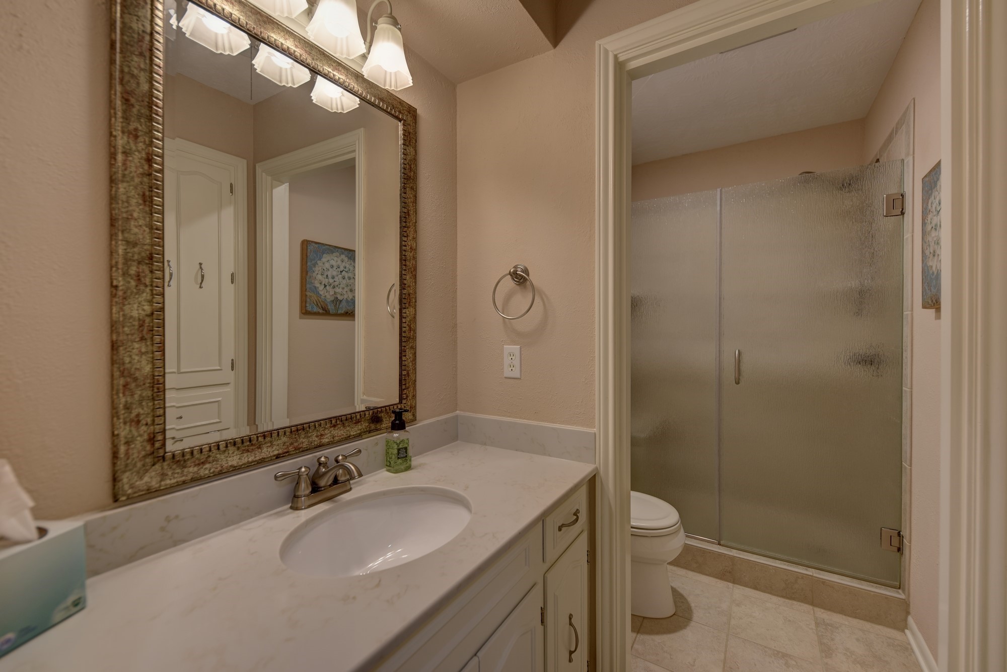 2502 Cheri Lane Brenham, TX 77833 - Photo 39 of 46 a bathroom with a granite countertop sink a mirror and a toilet