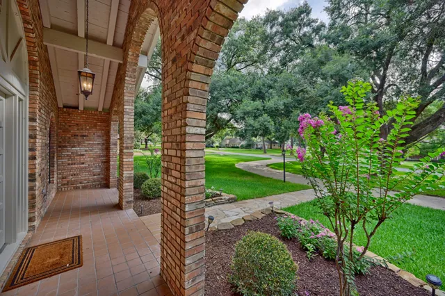 a view of house with backyard