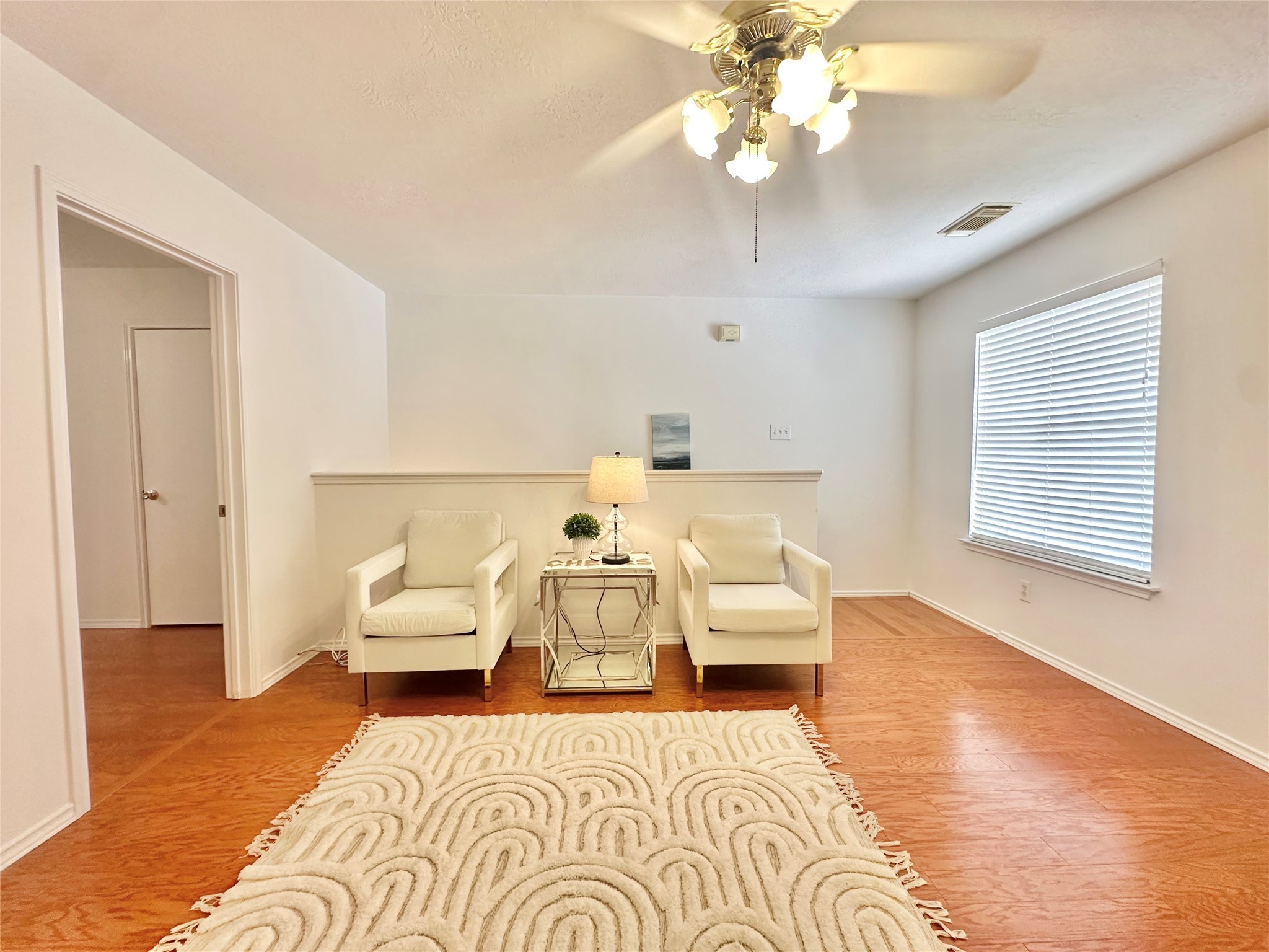 8223 Golf Green Circle Houston, TX 77036 - Photo 20 of 38 a bedroom with furniture and a chandelier