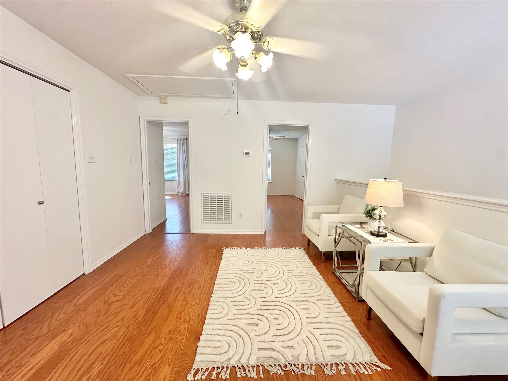 8223 Golf Green Circle Houston, TX 77036 - Photo 21 of 38 a view of a bedroom with a bed and wooden floor
