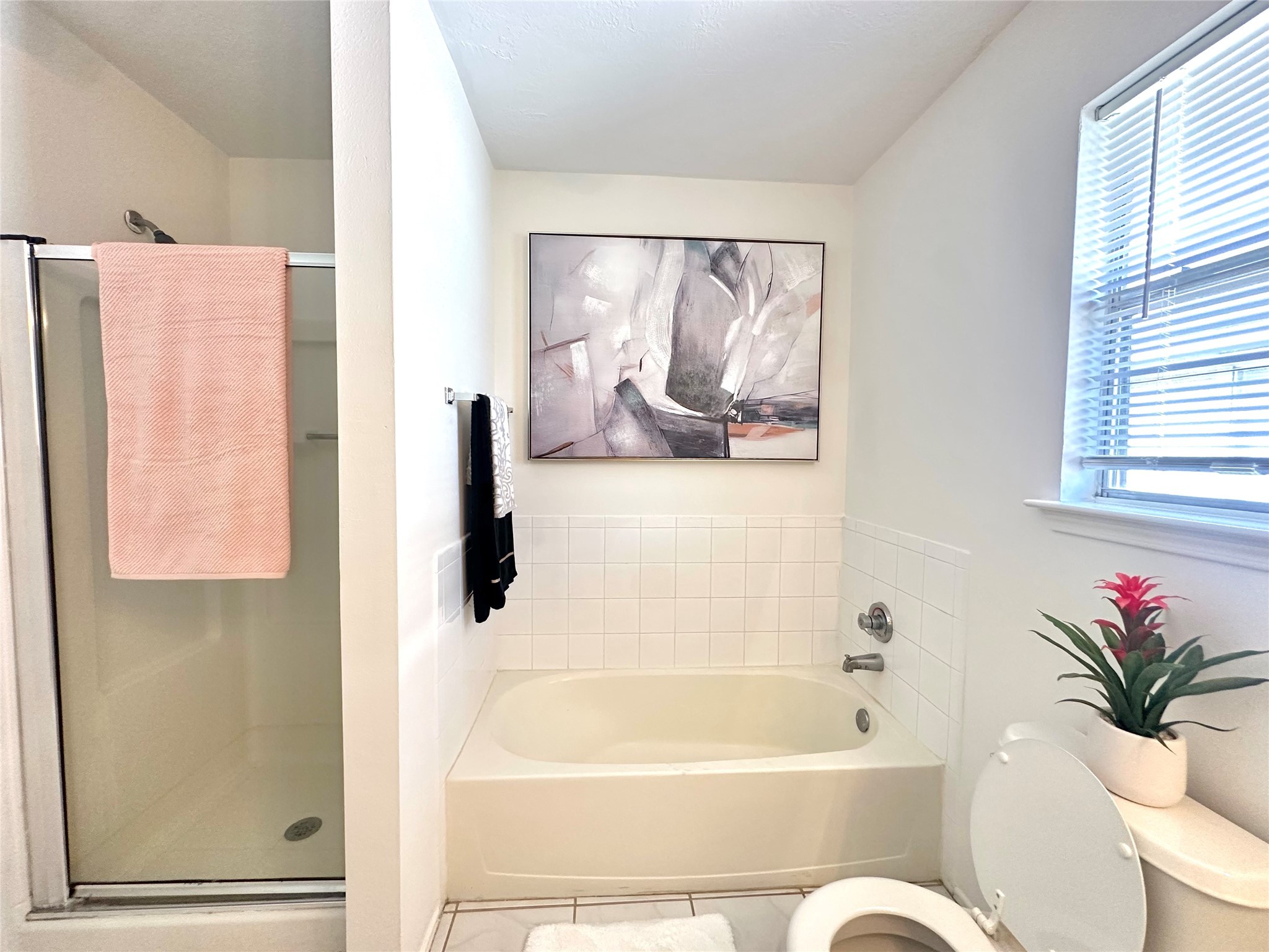 8223 Golf Green Circle Houston, TX 77036 - Photo 25 of 38 a bathroom with a bathtub and a shower