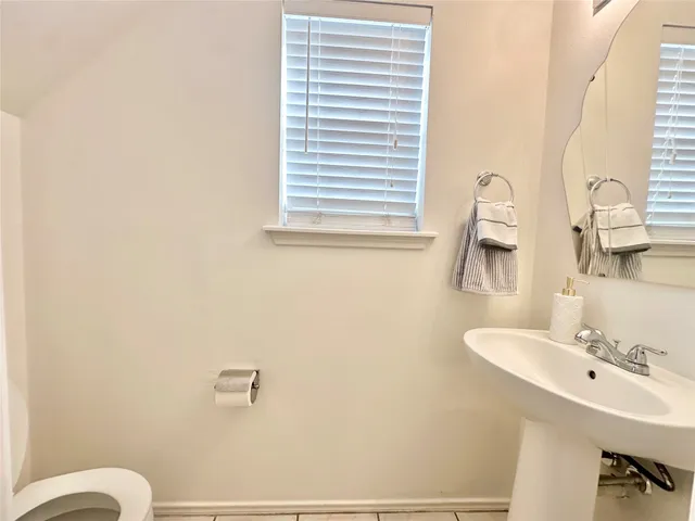 a view of a field of grass and trees