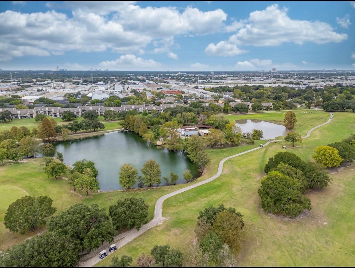 8223 Golf Green Circle Houston, TX 77036 - Photo 36 of 38 an aerial view of residential houses with outdoor space and lake view