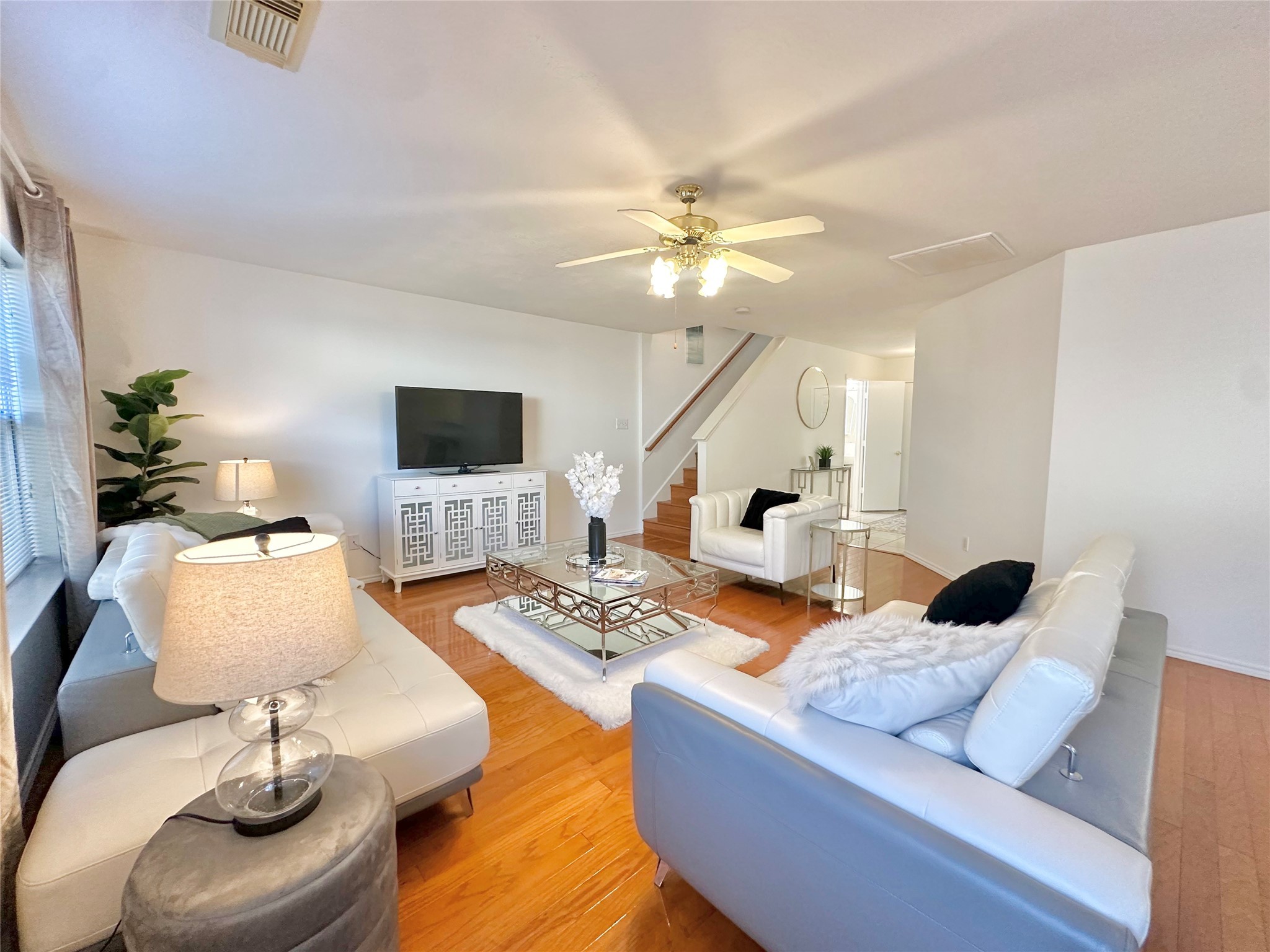 8223 Golf Green Circle Houston, TX 77036 - Photo 7 of 38 a living room with furniture and a flat screen tv