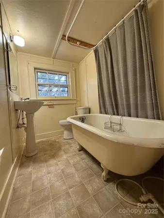a bathroom with a sink a bathtub and a shower