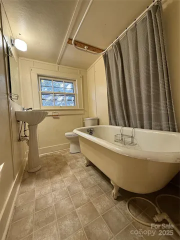 a bathroom with a sink a bathtub and a shower