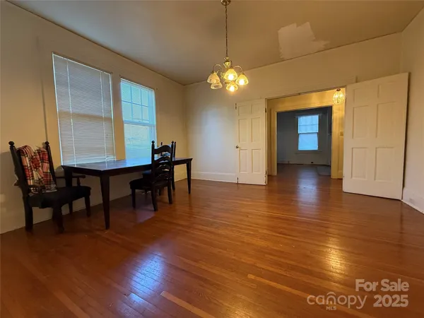 a view of a livingroom with furniture and wooden floor