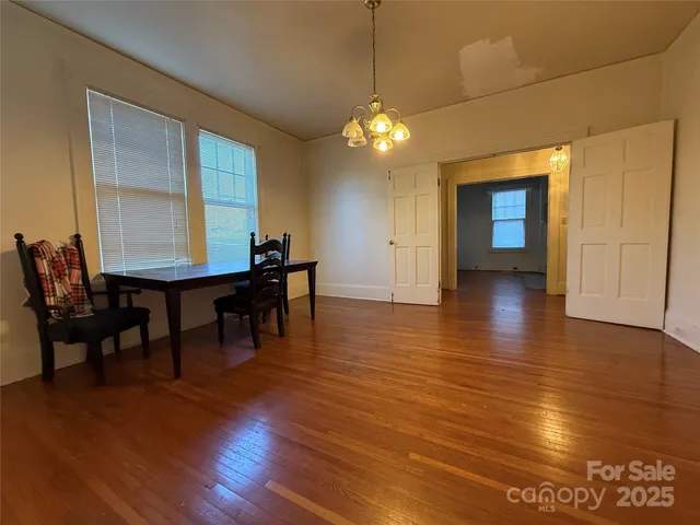 a view of a livingroom with furniture and wooden floor