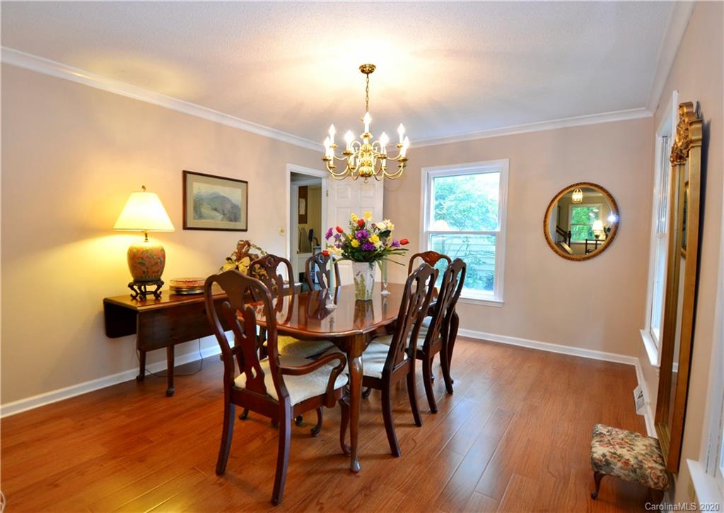 301 Sycamore Road Salisbury, NC 28147 - Photo 11 of 40 a view of a dining room with furniture and chandelier