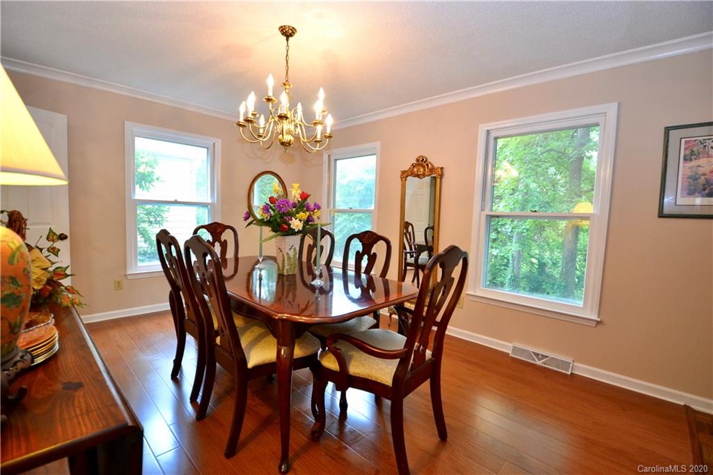 301 Sycamore Road Salisbury, NC 28147 - Photo 12 of 40 a view of a dining room with furniture window and wooden floor
