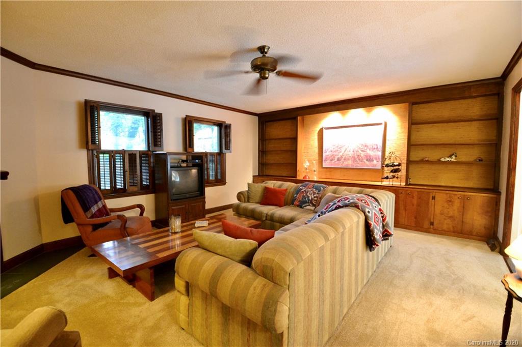 301 Sycamore Road Salisbury, NC 28147 - Photo 16 of 40 a bed room with a bed and a chair