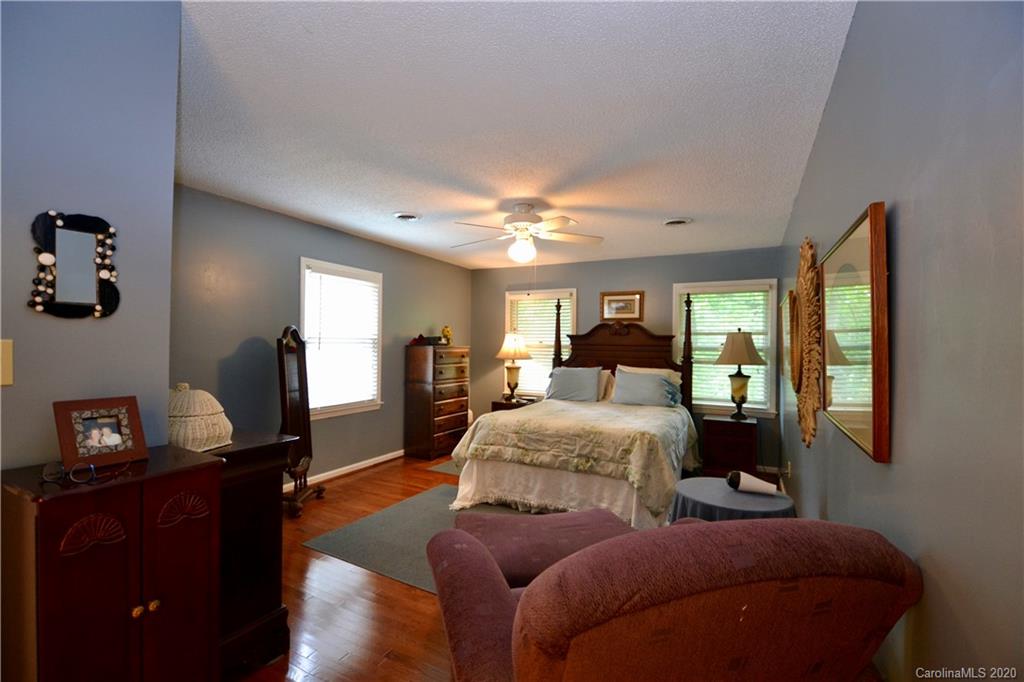 301 Sycamore Road Salisbury, NC 28147 - Photo 24 of 40 a bedroom with a bed and wooden floor