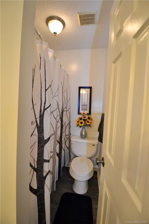 301 Sycamore Road Salisbury, NC 28147 - Photo 30 of 40 a bathroom with a toilet sink and shower curtain