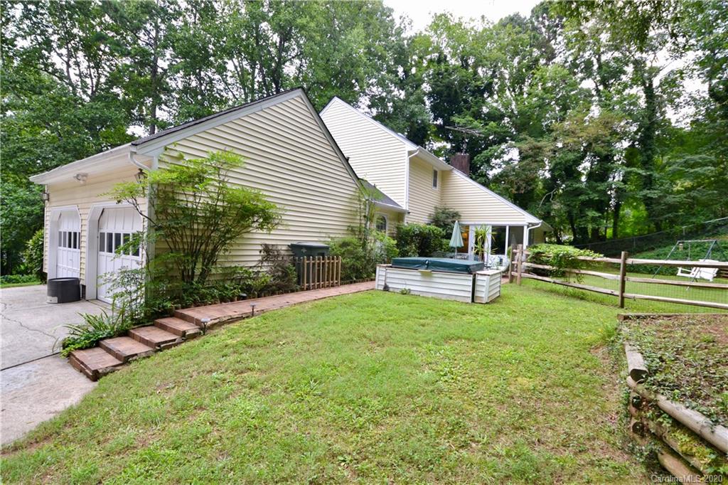 301 Sycamore Road Salisbury, NC 28147 - Photo 4 of 40 a view of a house with backyard and sitting area