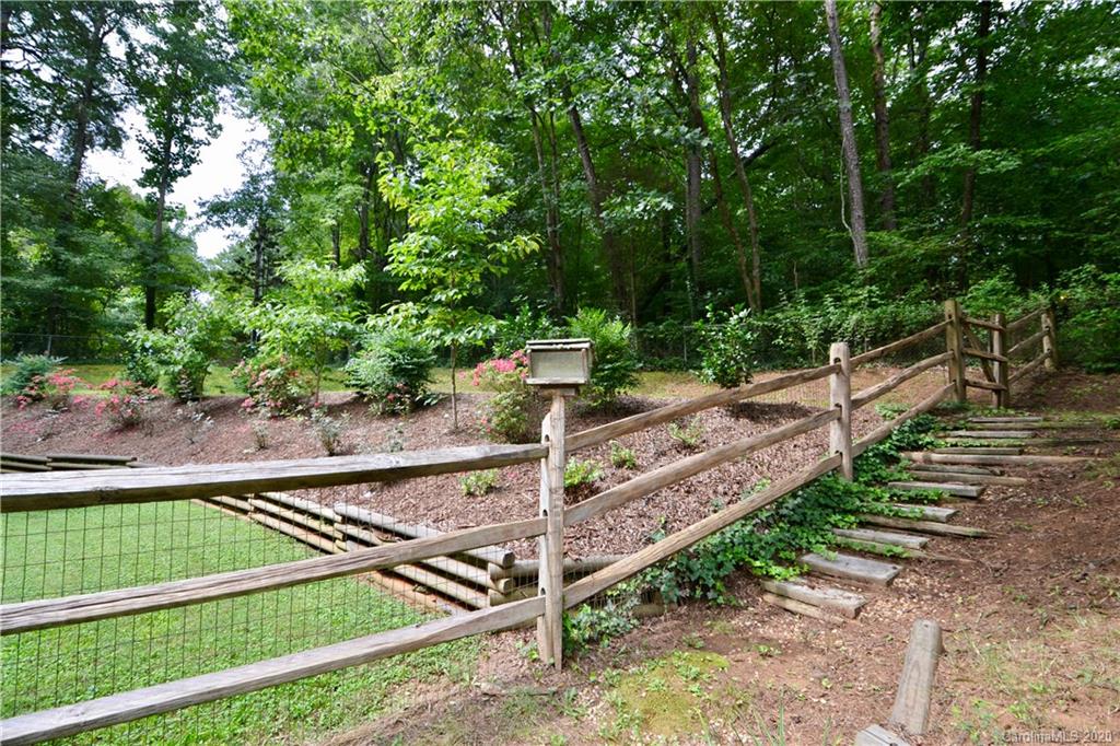 301 Sycamore Road Salisbury, NC 28147 - Photo 34 of 40 a view of a backyard with wooden fence