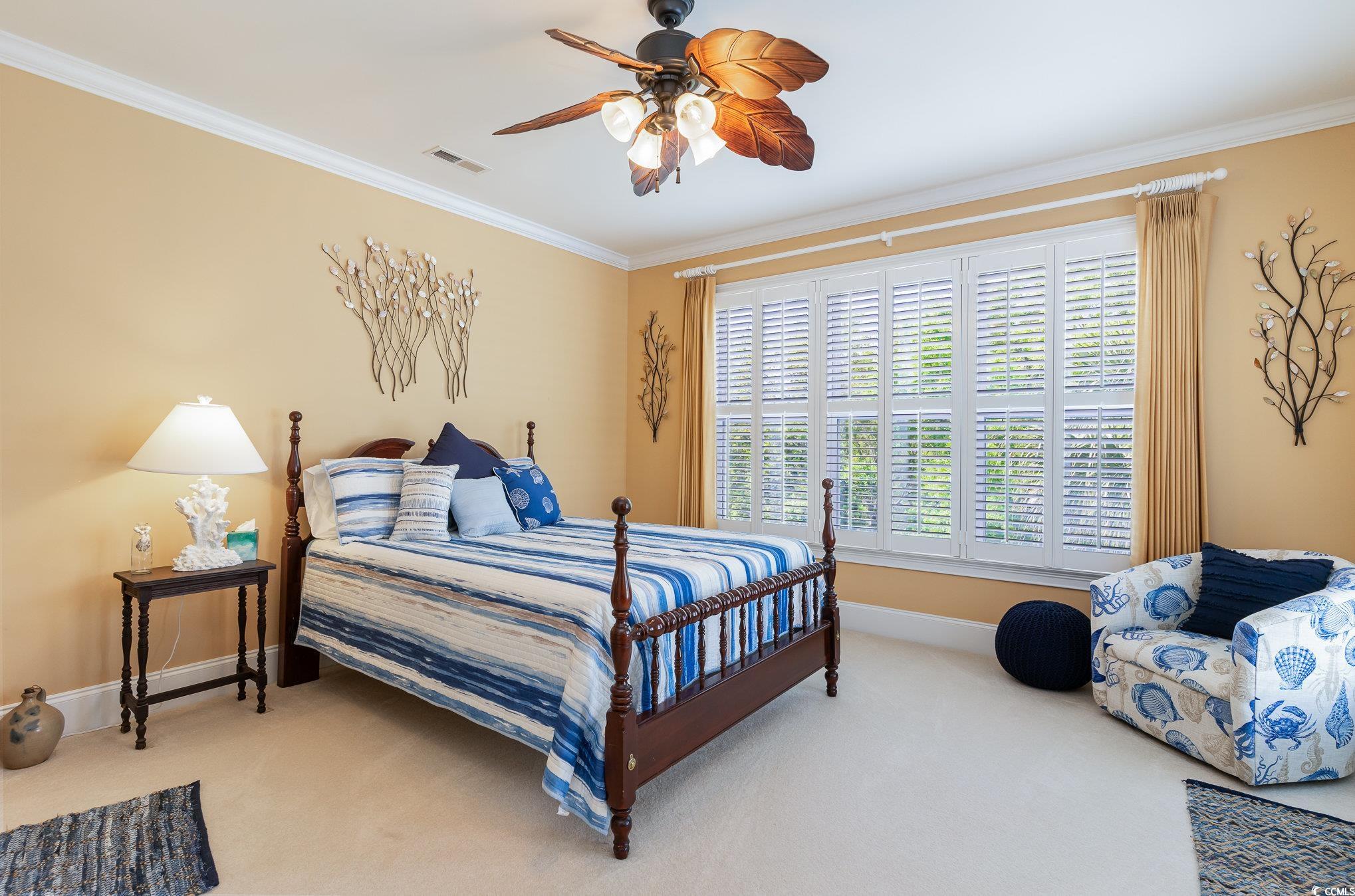 9 Gasparilla Drive Murrells Inlet, SC 29576 - Photo 24 of 40 Bedroom featuring baseboards, crown molding, carpet floors, visible vents, and ceiling fan