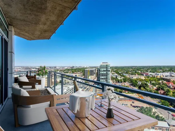a view of a balcony with city view