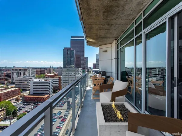 a view of balcony with furniture